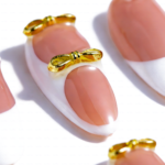 Peach Whisper -Soft Peach Short Almond Press-Ons with 3D Flower, Gold Bow & French Tip Detail - Image 6